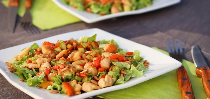 A plate with a tasty peppers chicken salad made with seasonal ingredients